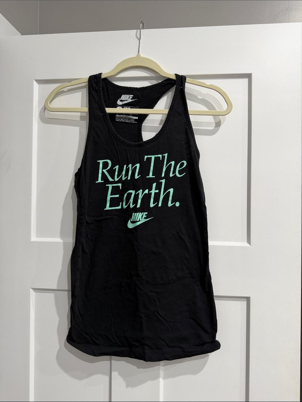 Nike Women's Black Tank Top with Mint Green 'Run The Earth' Graphic